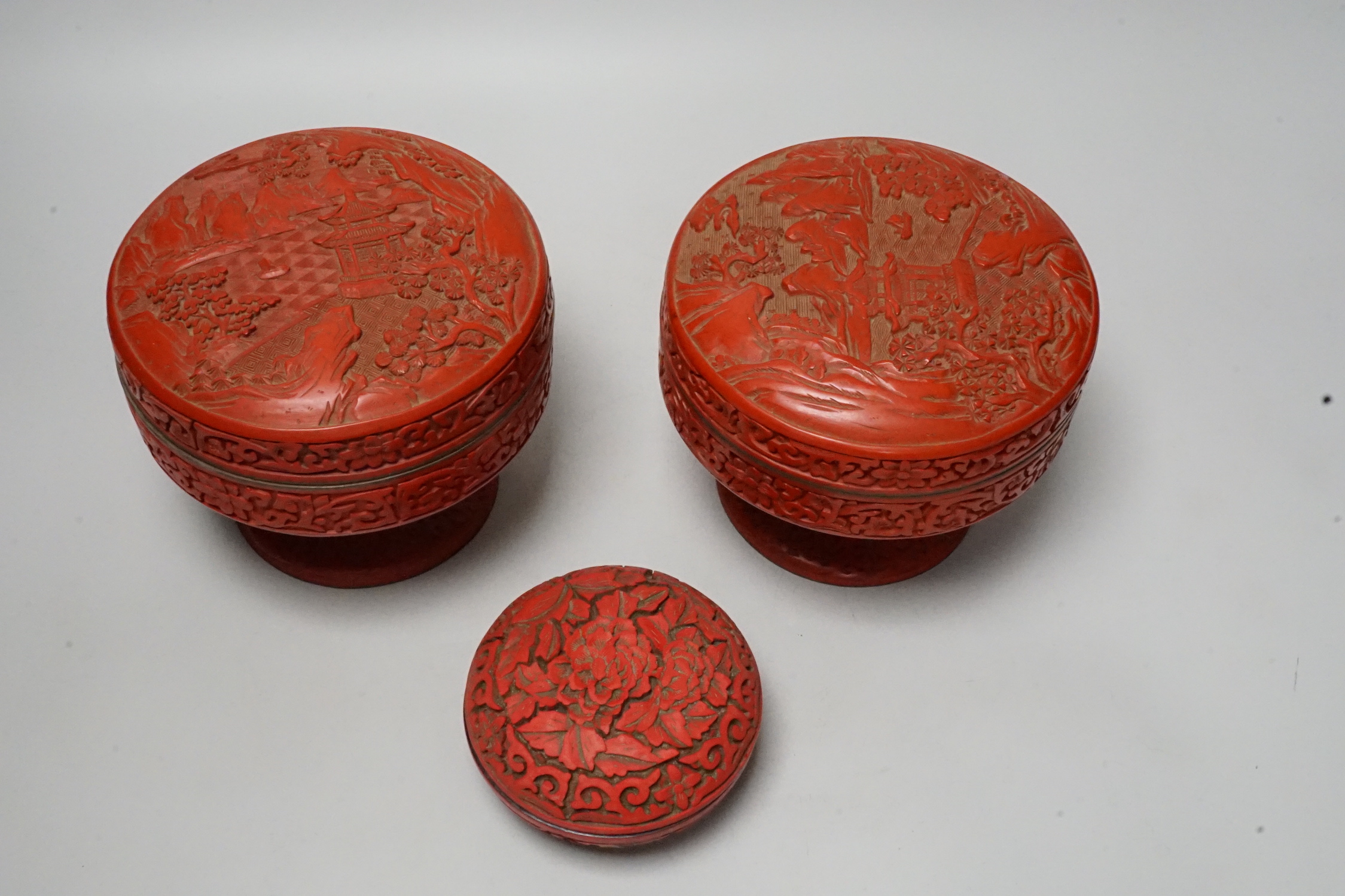 Two Chinese red lacquer stem dishes and covers and another box